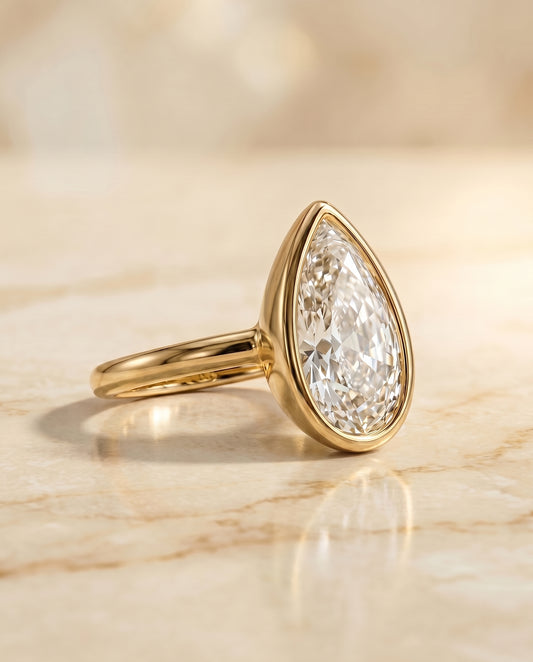 The Agnes Bezel Solitaire Engagement Ring Setting for Briolette Diamonds in 18K Yellow Gold