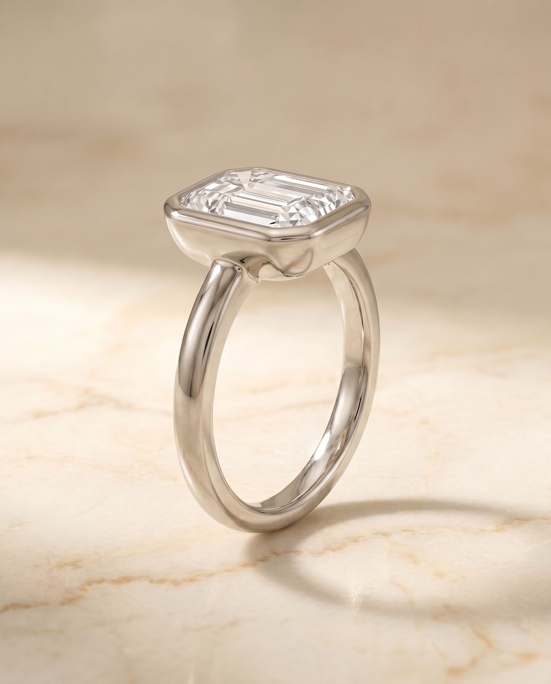 Bezel Solitaire In Cut styling on The Agnes emerald engagement ring setting | RockHer