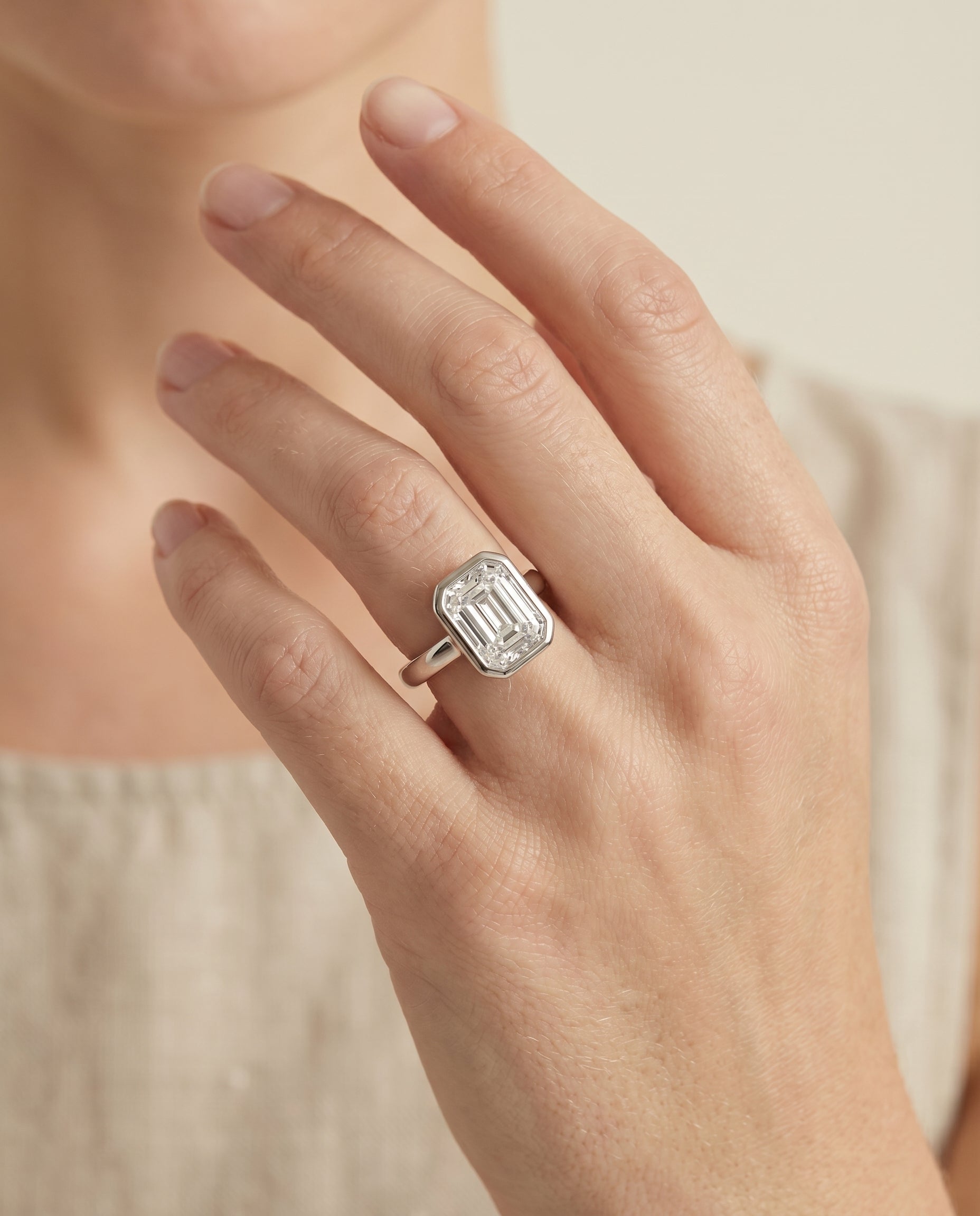 The Agnes engagement ring setting in Platinum, bezel solitaire in cut design | RockHer