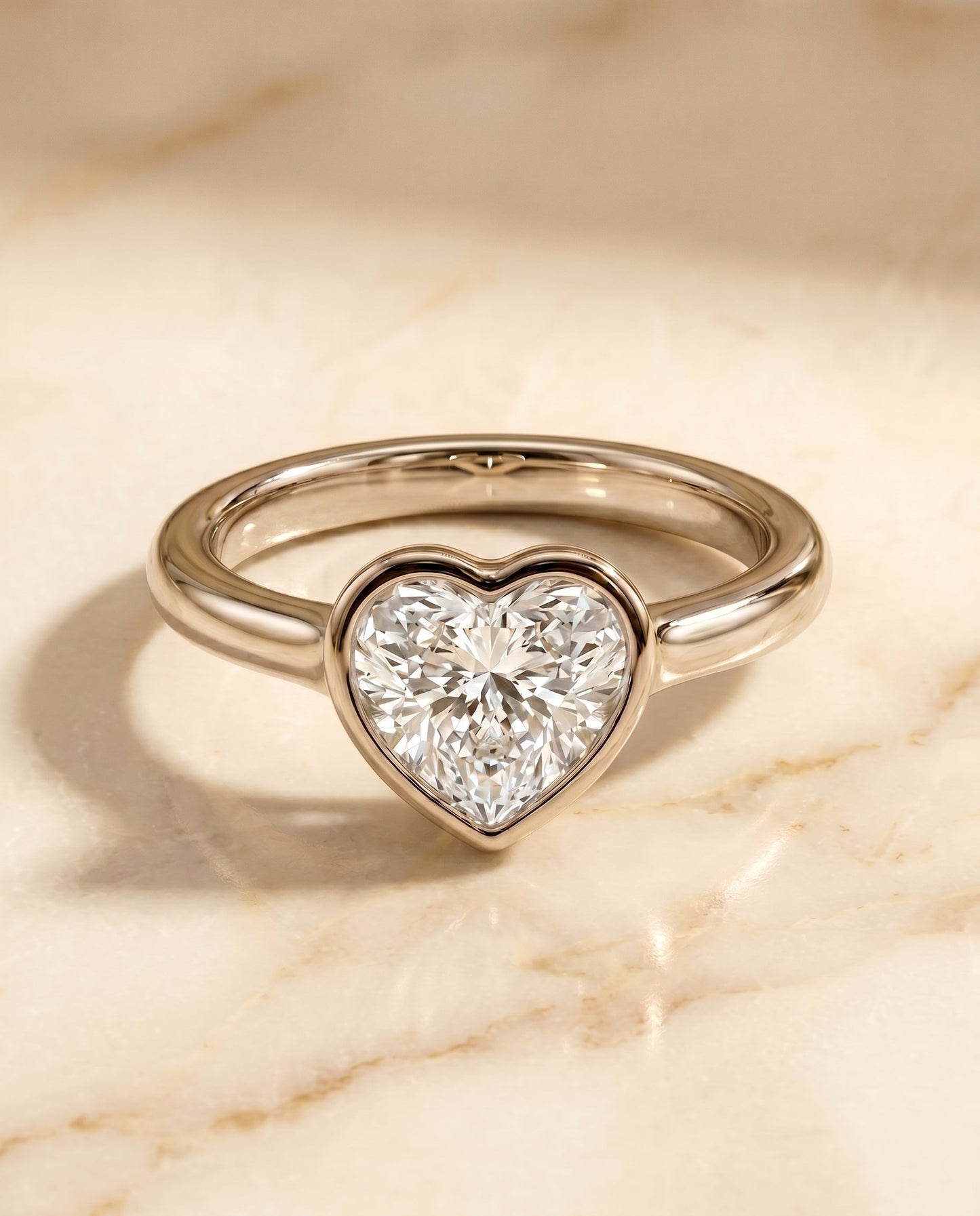 Agnes Select Bezel Solitaire In Heart Lab Diamond Engagement Ring in Platinum, shown on hand, angled | RockHer