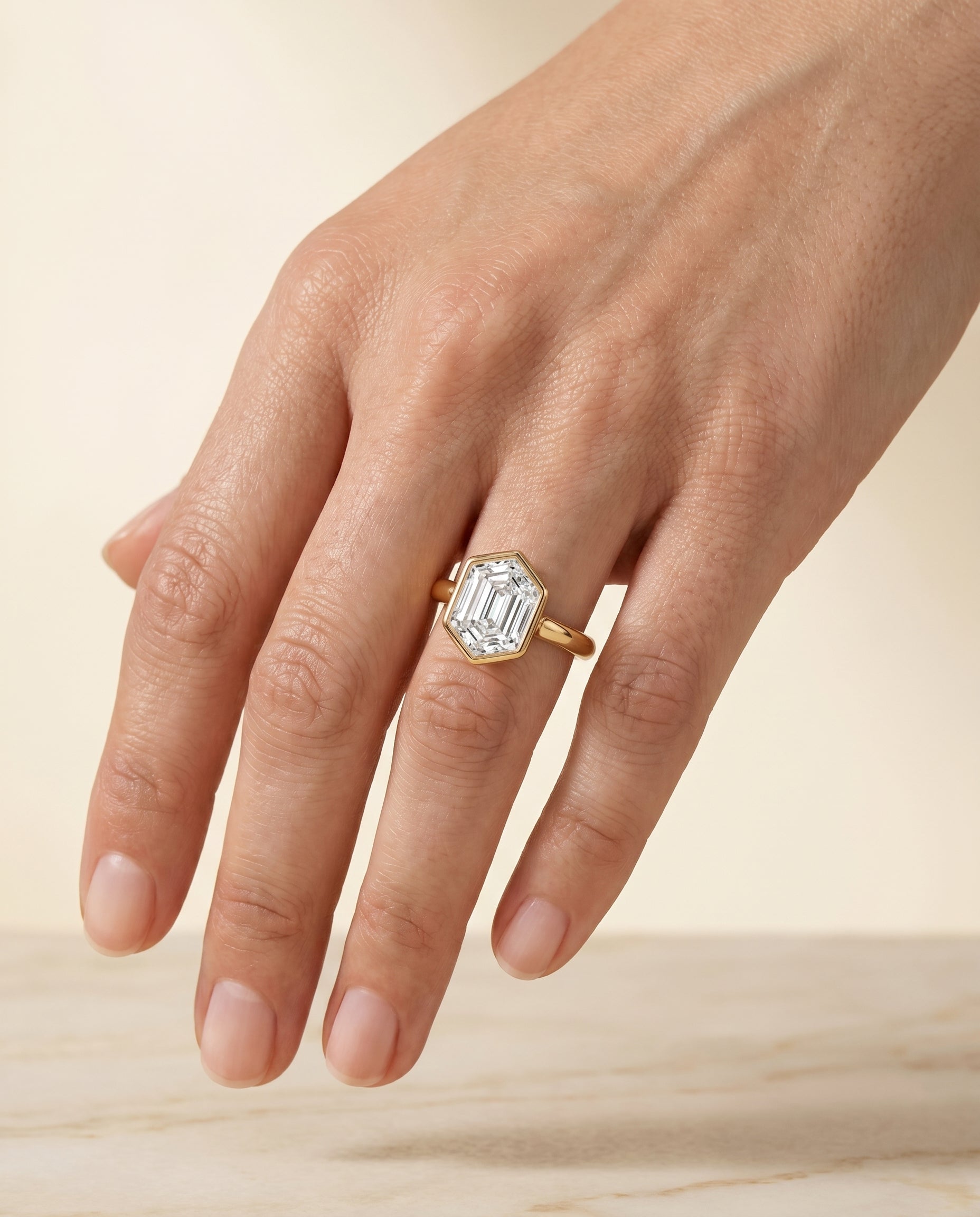 The Agnes engagement ring setting in 18K Yellow Gold, bezel solitaire in hexagon design | RockHer