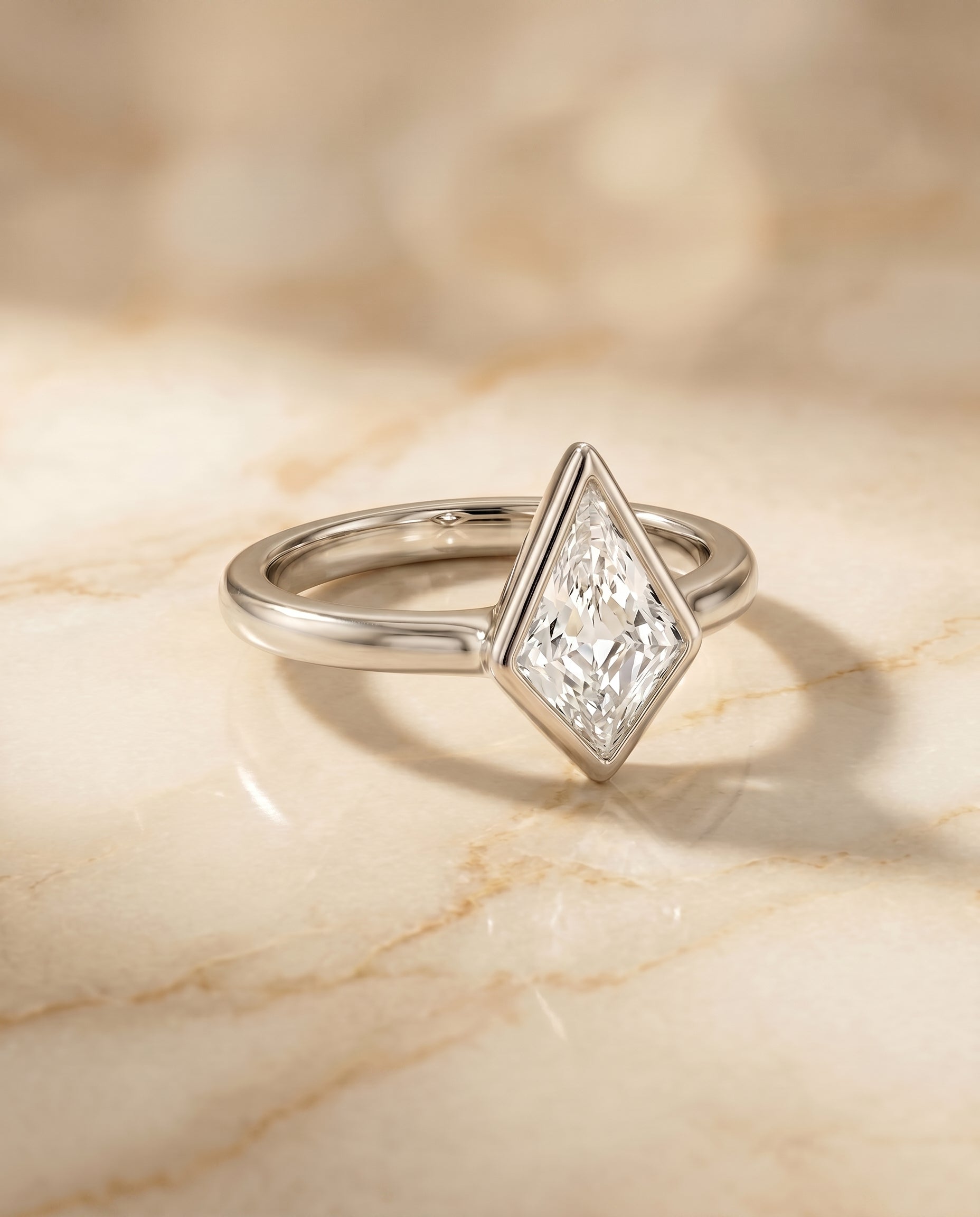 Bezel Solitaire In styling on The Agnes kite engagement ring setting | RockHer