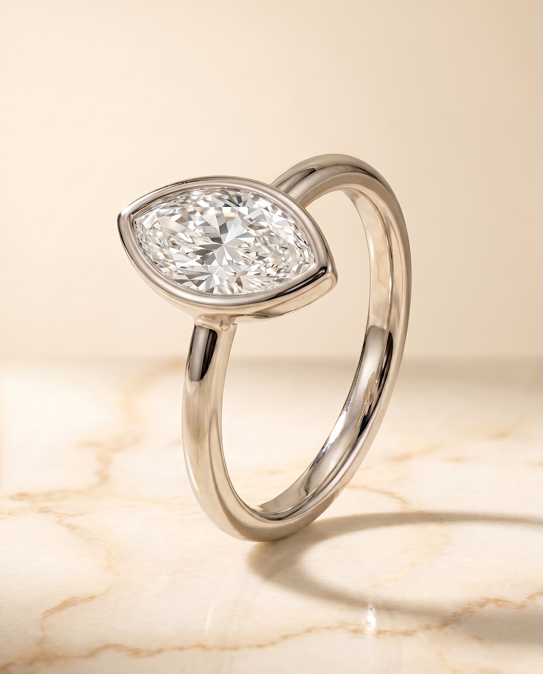 Bezel Solitaire In styling on The Agnes marquise engagement ring setting | RockHer