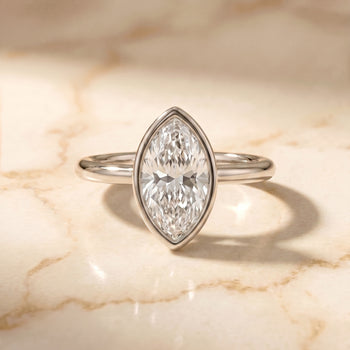 The Agnes Bezel Solitaire In Marquise Engagement Ring Setting in Platinum