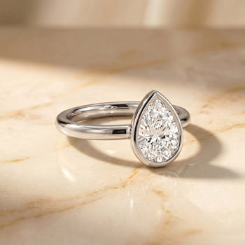 The Agnes Bezel Solitaire In Pear Engagement Ring Setting in Platinum
