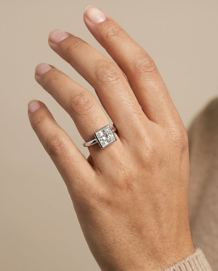 The Agnes Bezel Solitaire Engagement Ring Setting for Princess Diamonds in Platinum