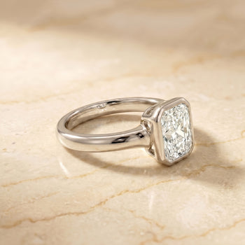 The Agnes Bezel Solitaire In Radiant Cut Engagement Ring Setting in Platinum