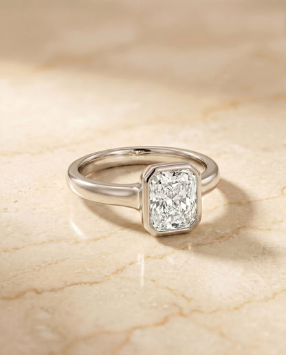 The Agnes Bezel Solitaire In Radiant Cut Engagement Ring Setting in 18K White Gold