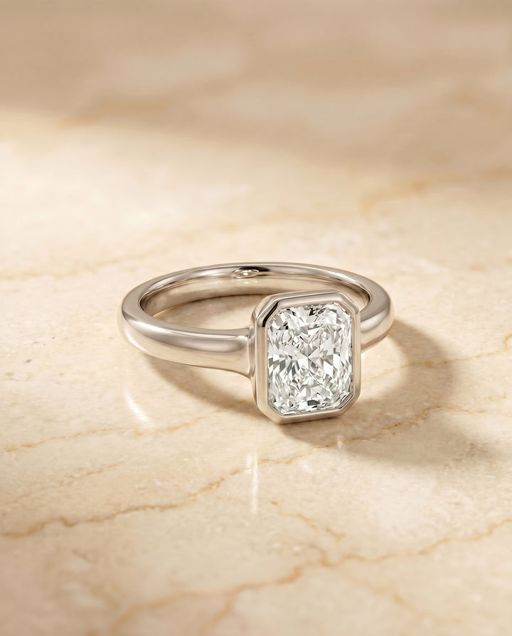 The Agnes Bezel Solitaire In Radiant Cut Engagement Ring Setting in 18K White Gold