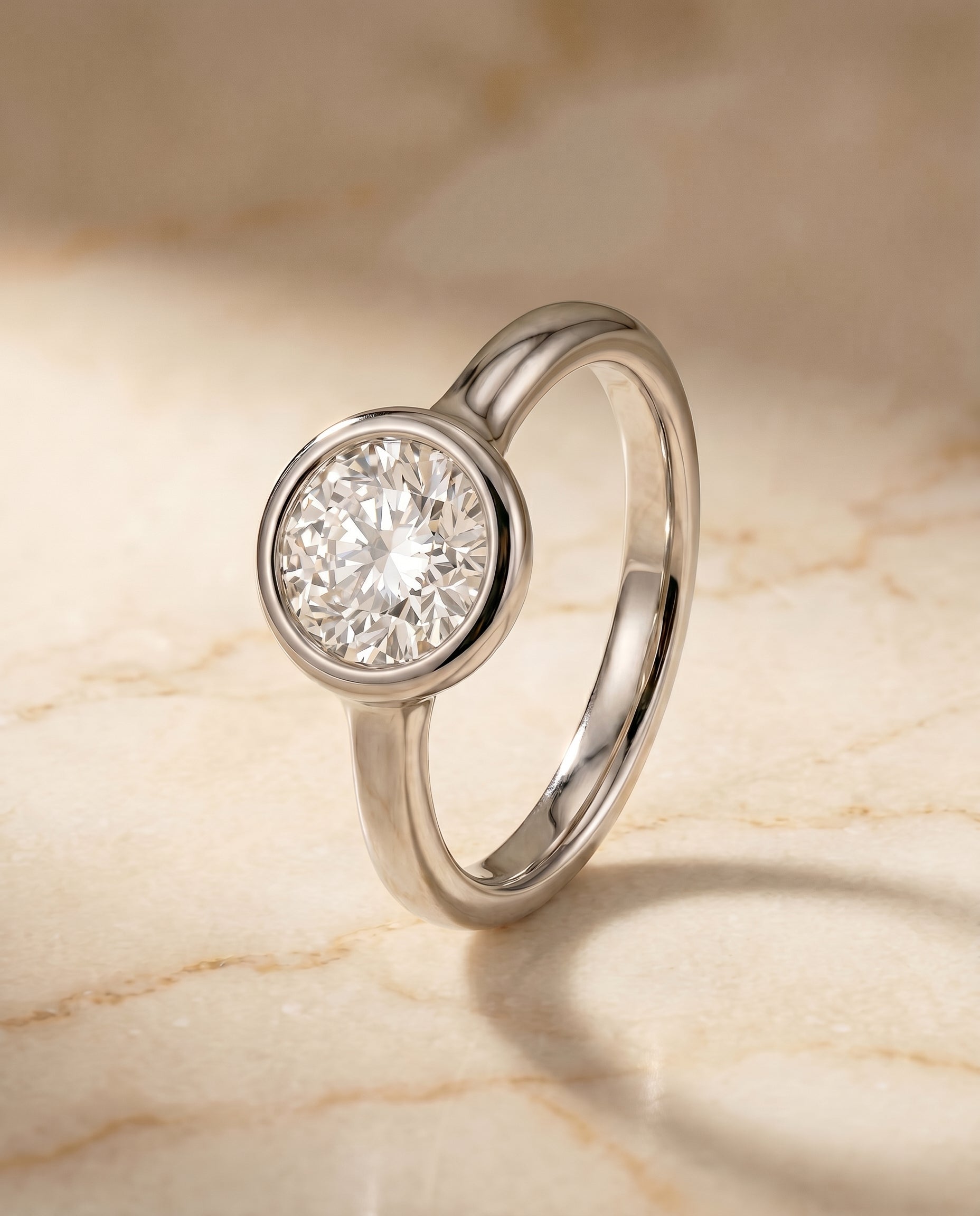 Bezel Solitaire In styling on The Agnes round engagement ring setting | RockHer