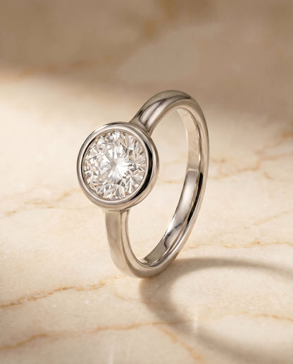 Agnes Select Bezel Solitaire In Round Lab Diamond Engagement Ring in Platinum, front view | RockHer