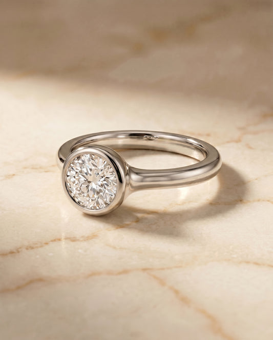The Agnes Bezel Solitaire Engagement Ring Setting for Round Diamonds in 18K White Gold