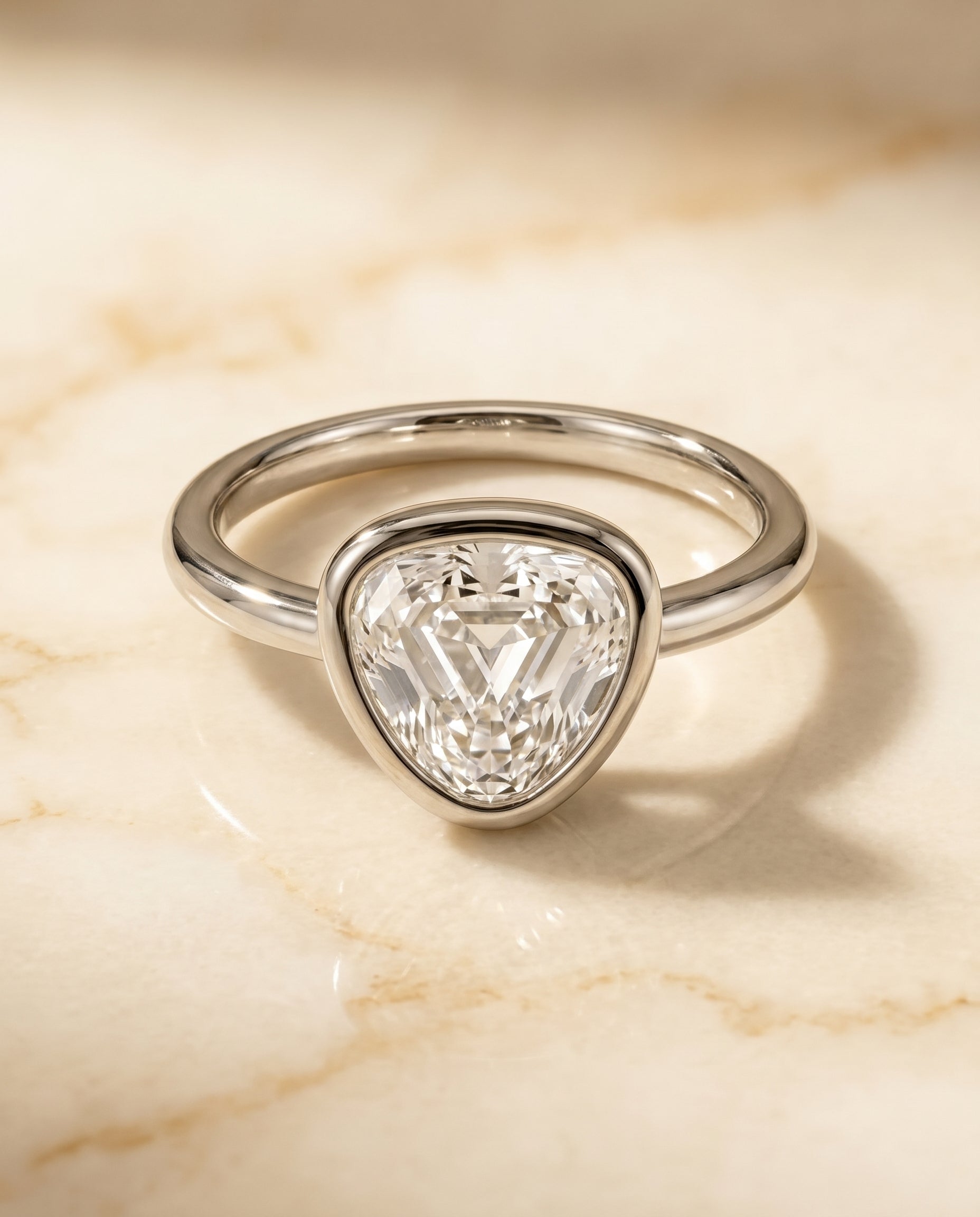 The Agnes Bezel Solitaire In Shield Engagement Ring Setting in Platinum
