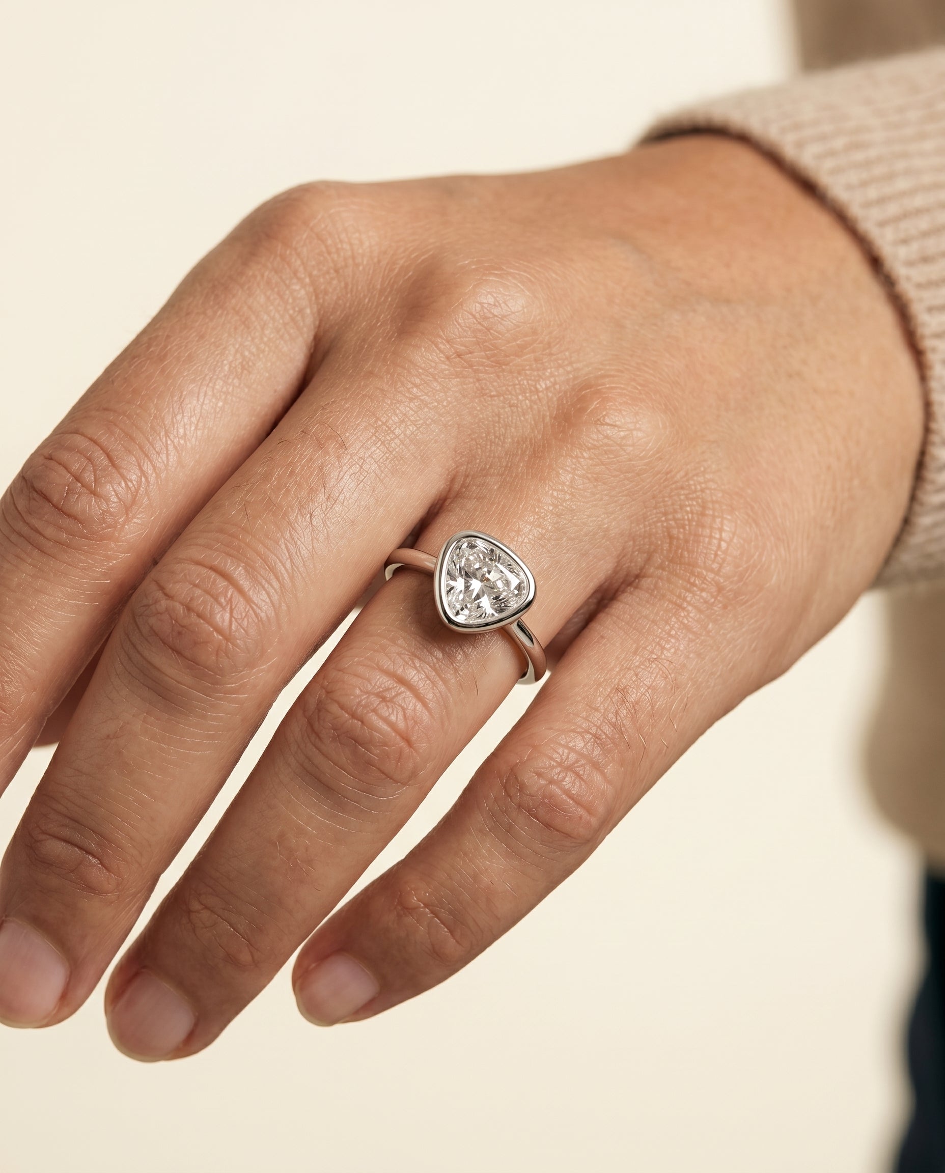 The Agnes engagement ring setting in Platinum, bezel solitaire in shield design | RockHer