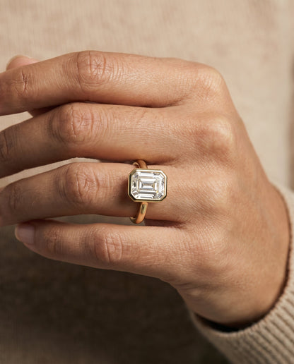 Agnes Select Square Bezel Solitaire In Step Lab Diamond Engagement Ring in 18K Yellow Gold, shown on hand | RockHer