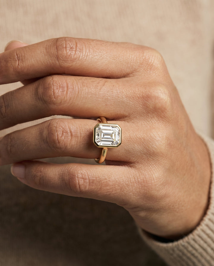 Agnes Select Square Bezel Solitaire In Step Lab Diamond Engagement Ring in 18K Yellow Gold, shown on hand | RockHer
