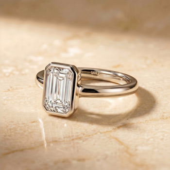 The Agnes Bezel Solitaire In Tapered Baguette Engagement Ring Setting in Platinum