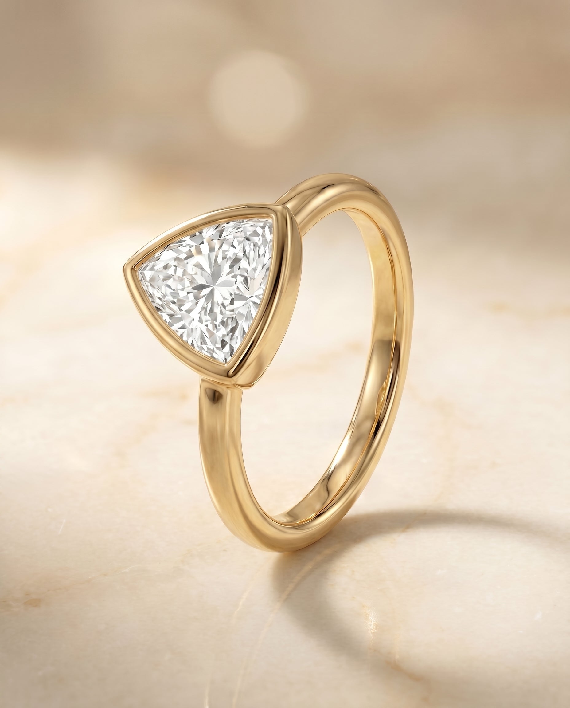 Bezel Solitaire In styling on The Agnes trillion engagement ring setting | RockHer