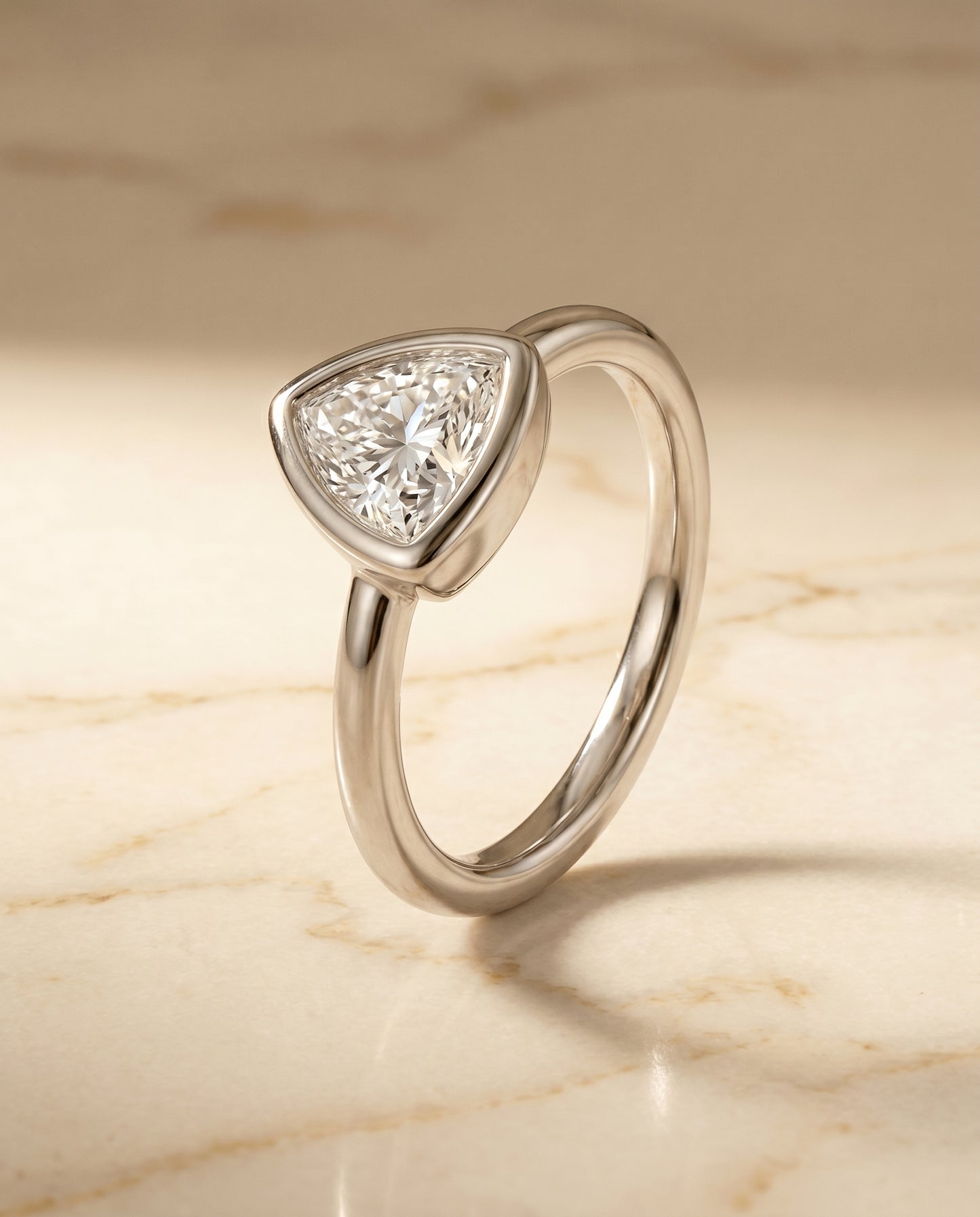 The Agnes Bezel Solitaire In Trillion Engagement Ring Setting in Platinum