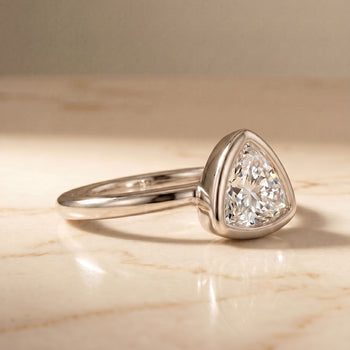 The Agnes Bezel Solitaire In Trillion Engagement Ring Setting in Platinum