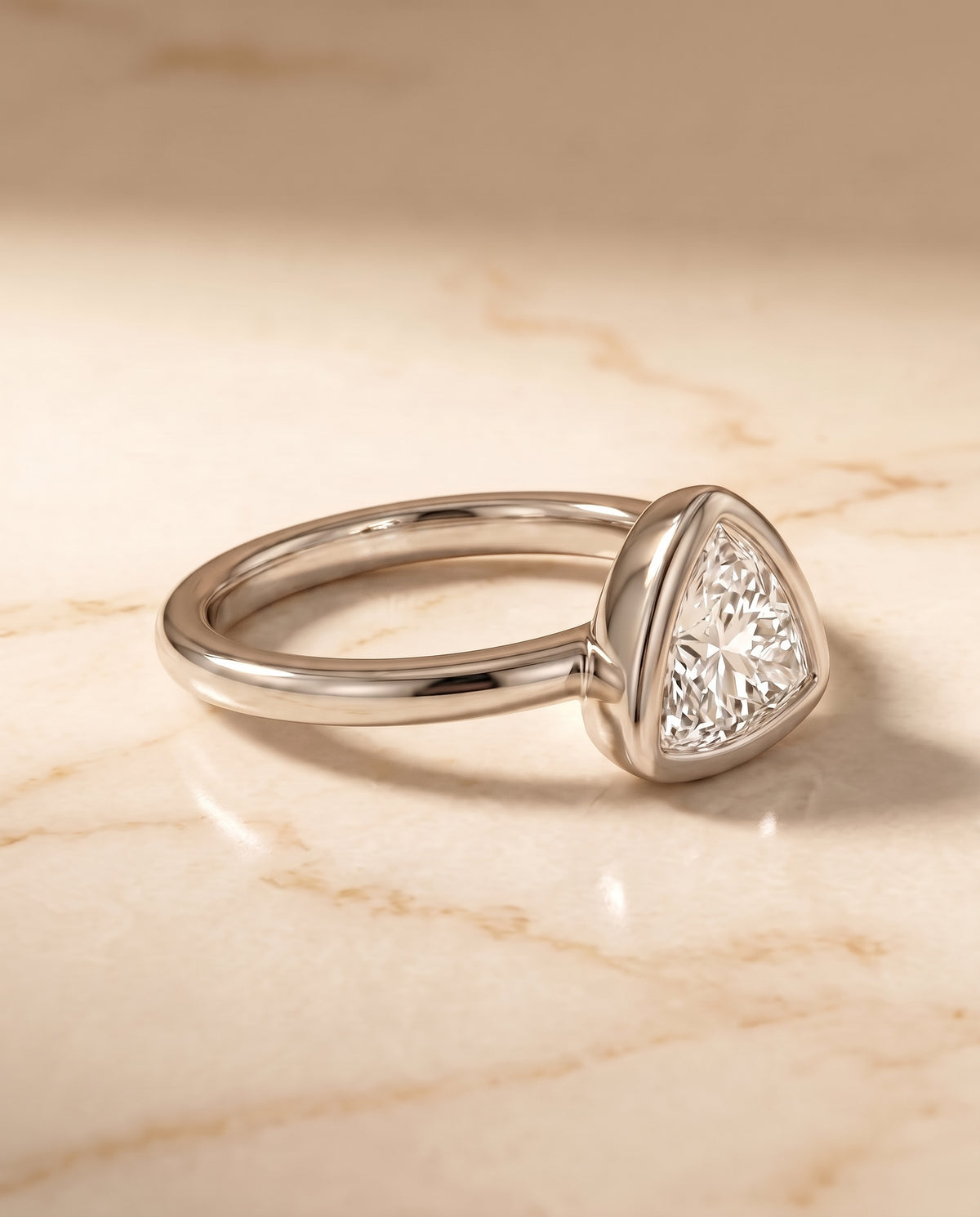 The Agnes Bezel Solitaire In Trillion Engagement Ring Setting in 18K White Gold
