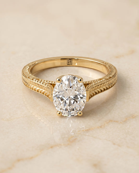 The Aida Solitaire Engagement Ring Setting for Oval Diamonds in 18K Yellow Gold