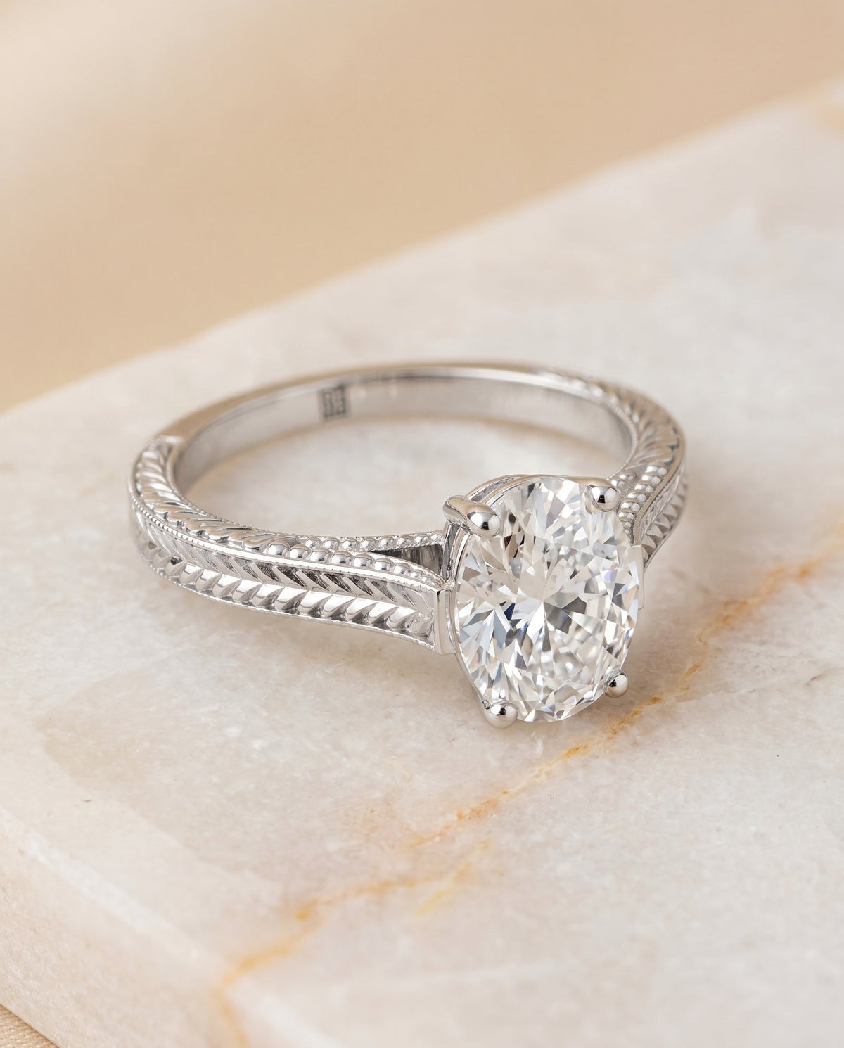 Aida Select Vintage Solitaire Oval Lab Diamond Engagement Ring in Platinum, shown on hand, angled | RockHer