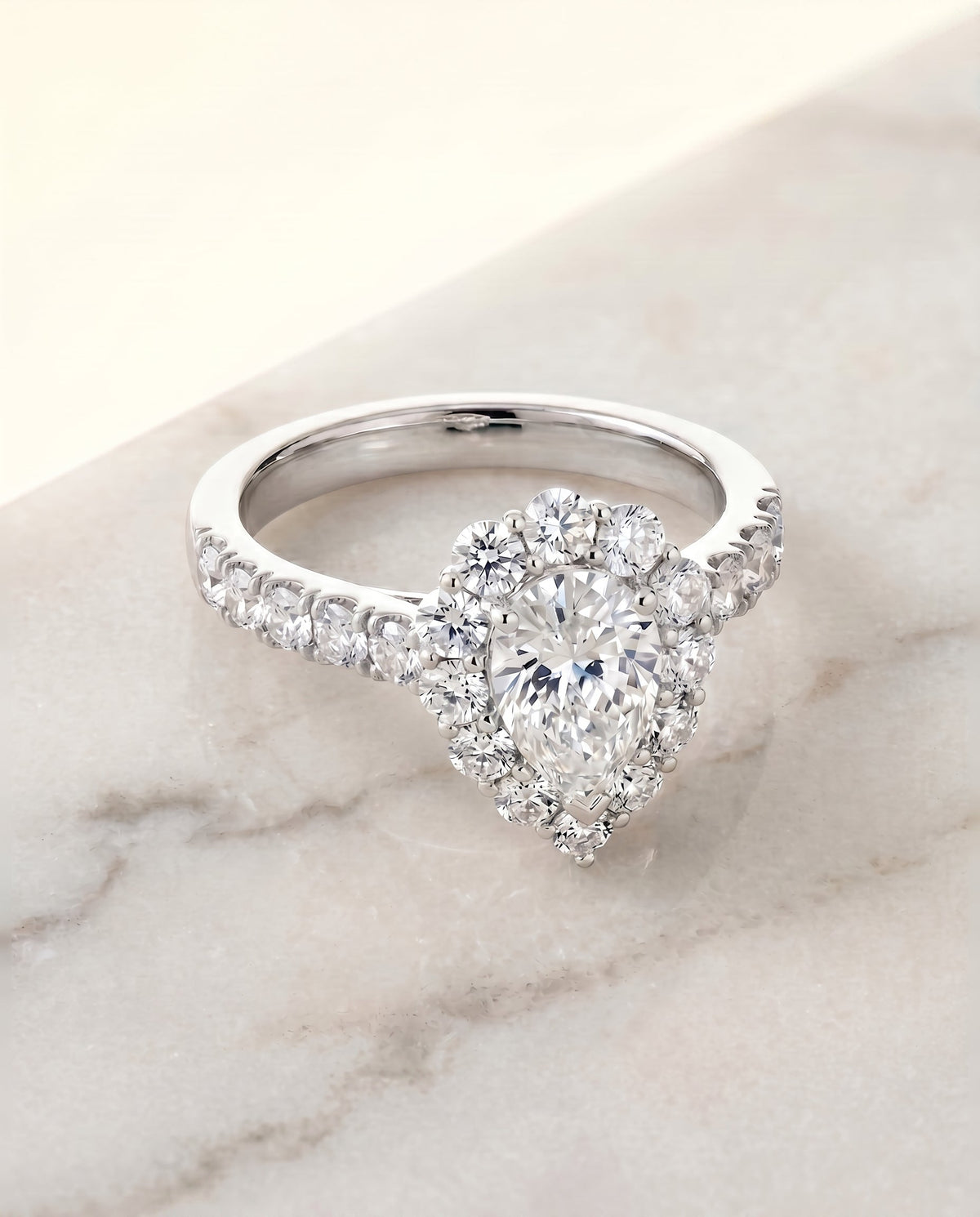 Alannah Select Halo Pear Lab Diamond Engagement Ring in 18K White Gold, shown on hand, angled | RockHer