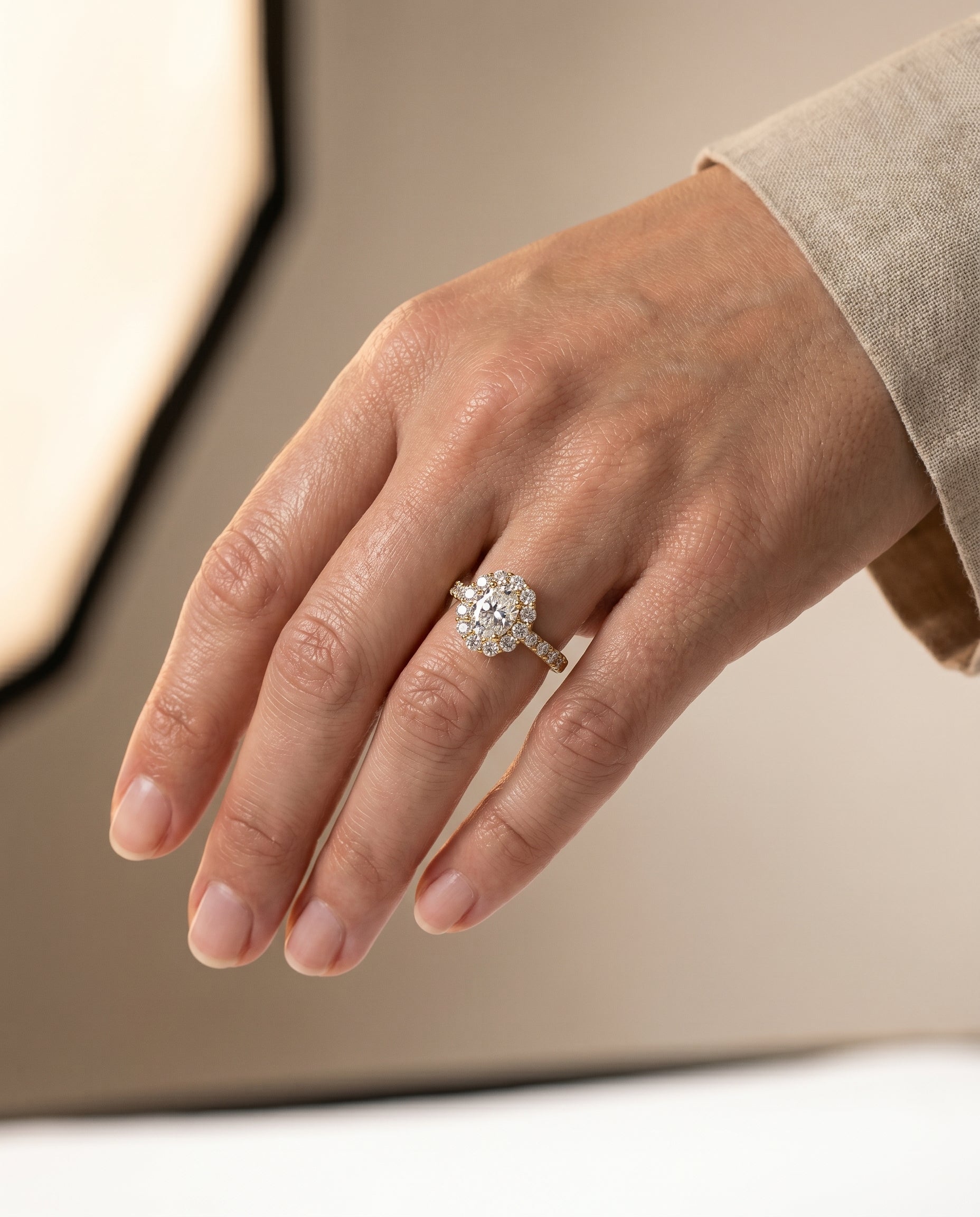 Alannah Select Luxe French Pavé Halo Oval Lab Diamond Engagement Ring in 18K Yellow Gold, shown on hand, angled | RockHer