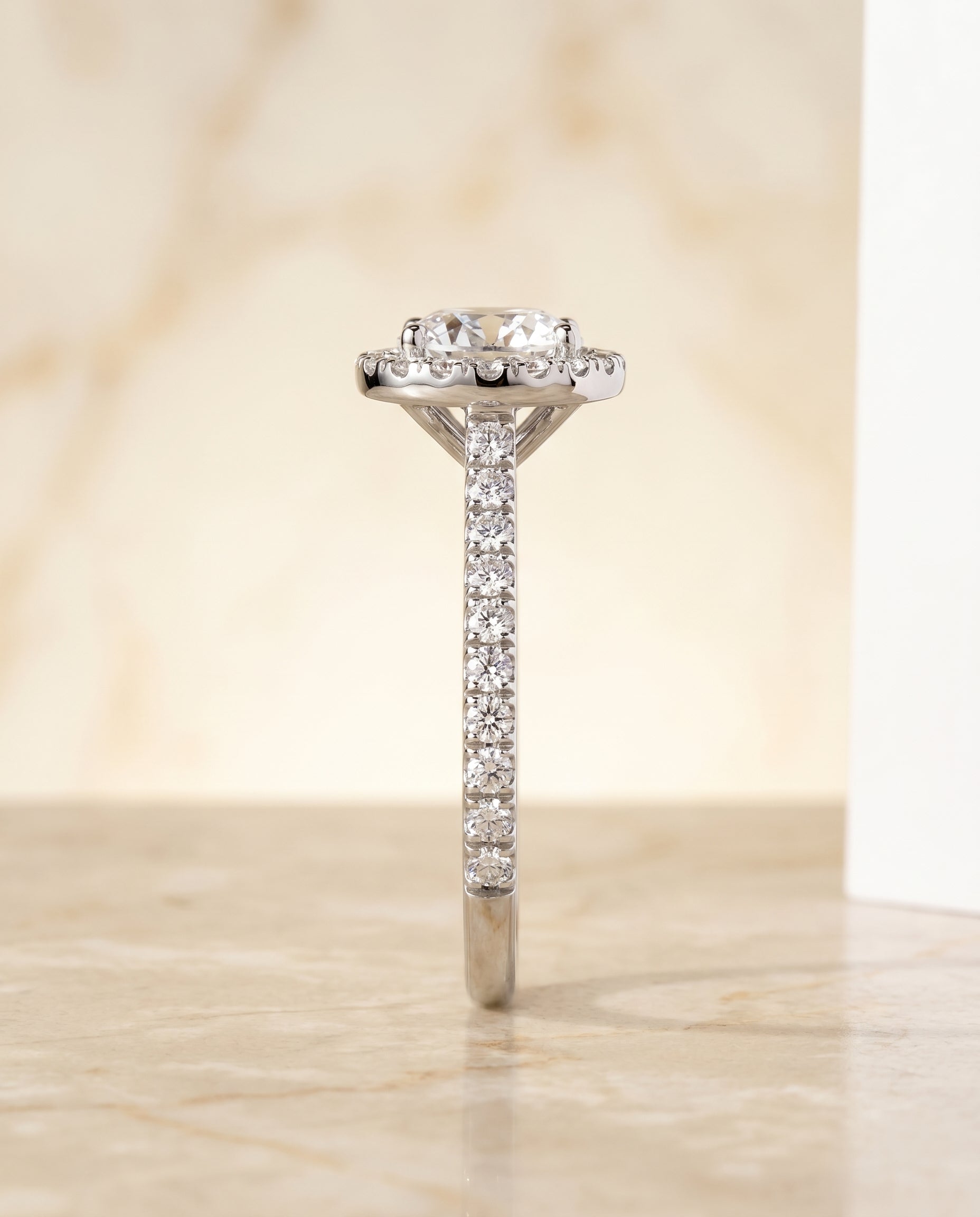 Shared Prong Pavé Halo styling on The Allegra round engagement ring setting | RockHer