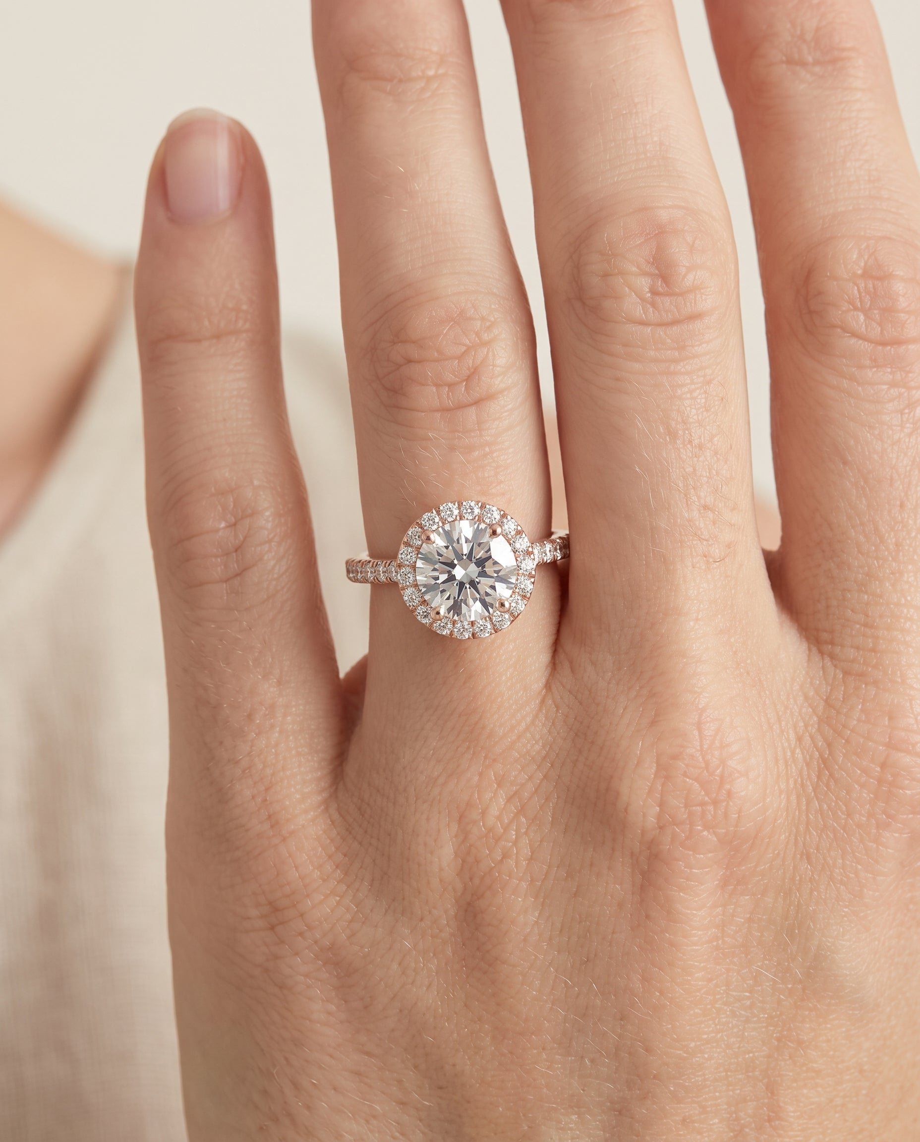 The Allegra engagement ring setting in 14K Rose Gold, shared prong pavé halo design | RockHer