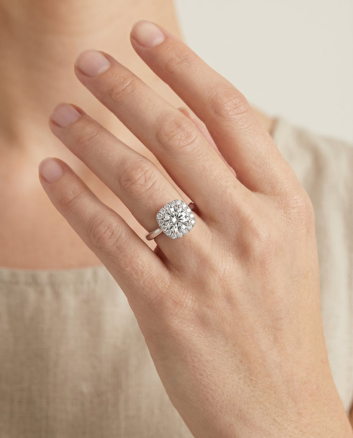 Amy Select Halo Round Lab Diamond Engagement Ring in 18K White Gold, shown on hand | RockHer