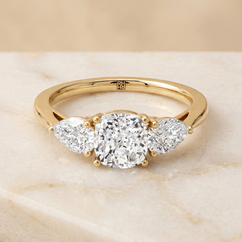 The Angelica Three Stone Matched Cushion Cut Engagement Ring Setting in 18K Yellow Gold