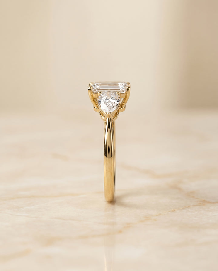 The Angelica Three Stone Engagement Ring Setting for Emerald Cut Diamonds in 18K Yellow Gold