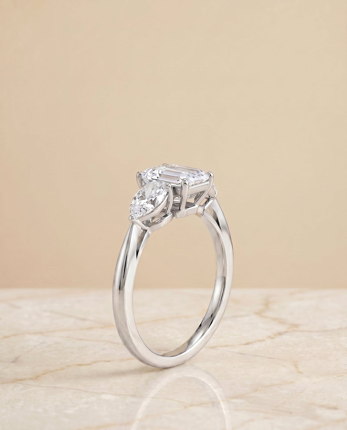 Angelica Select Three Stone Emerald Cut Lab Diamond Engagement Ring in Platinum, side view | RockHer