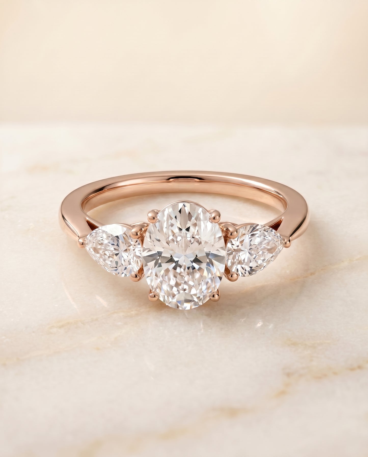 The Angelica Three Stone Engagement Ring Setting for Oval Diamonds in 14K Rose Gold