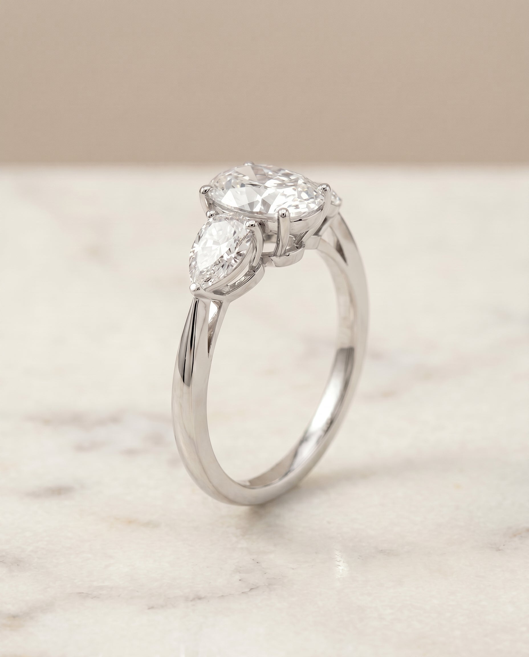 Three Stone Matched styling on The Angelica oval engagement ring setting | RockHer