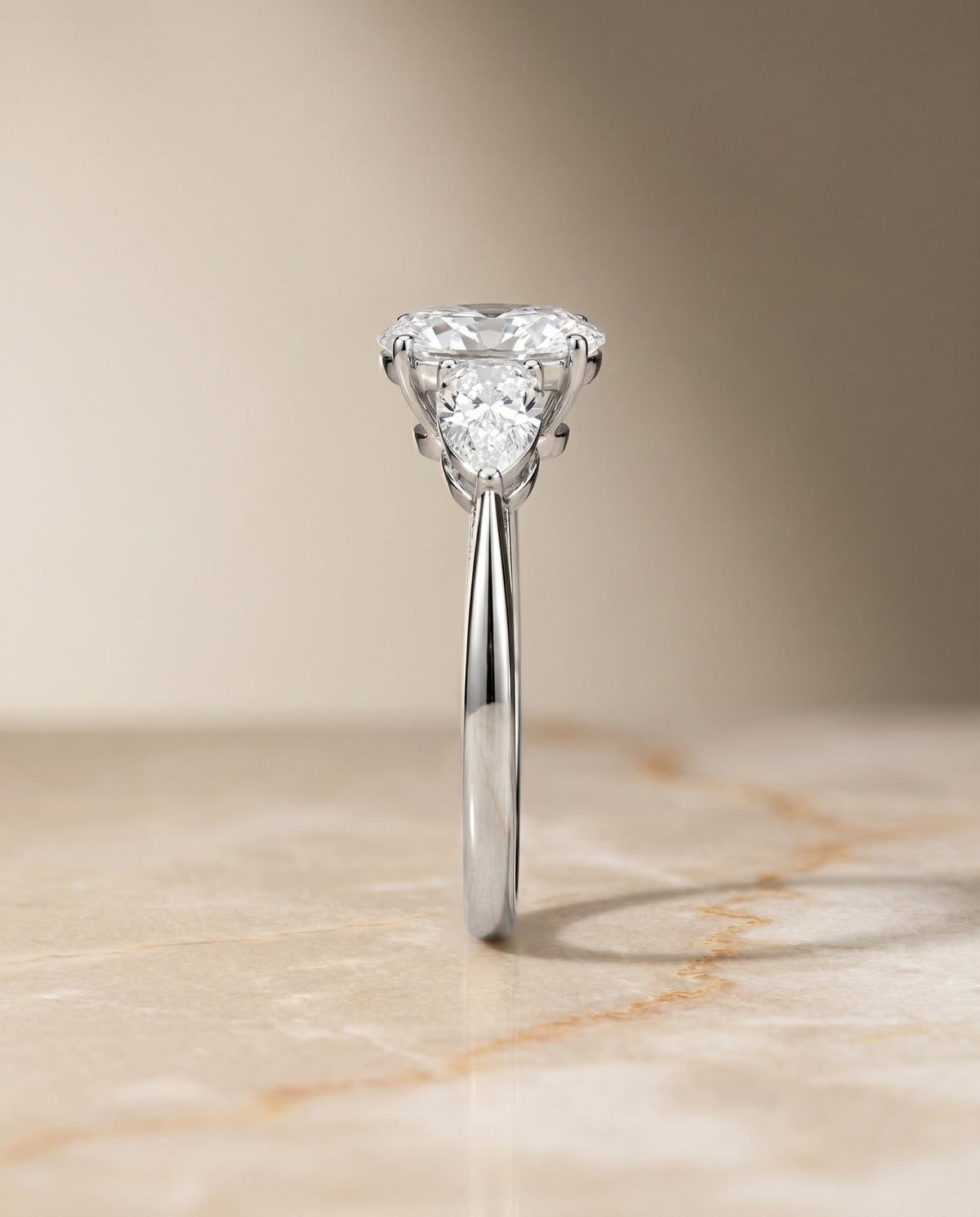Angelica Select Three Stone Oval Lab Diamond Engagement Ring in Platinum, side view | RockHer