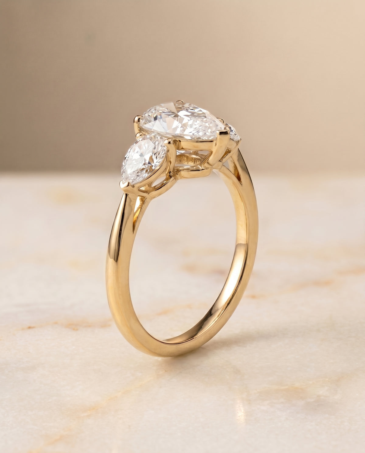 Three Stone Matched styling on The Angelica pear engagement ring setting | RockHer