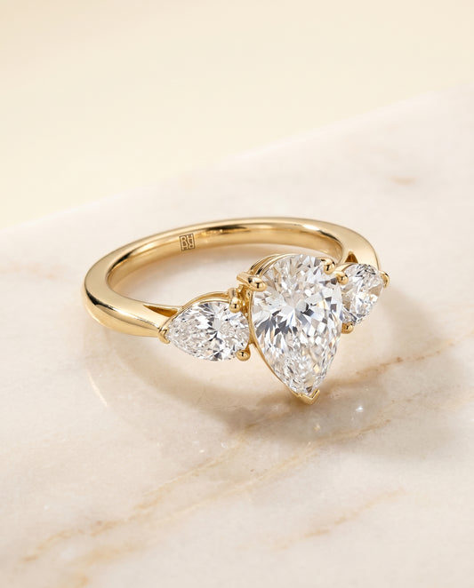 The Angelica Three Stone Engagement Ring Setting for Pear Diamonds in 18K Yellow Gold