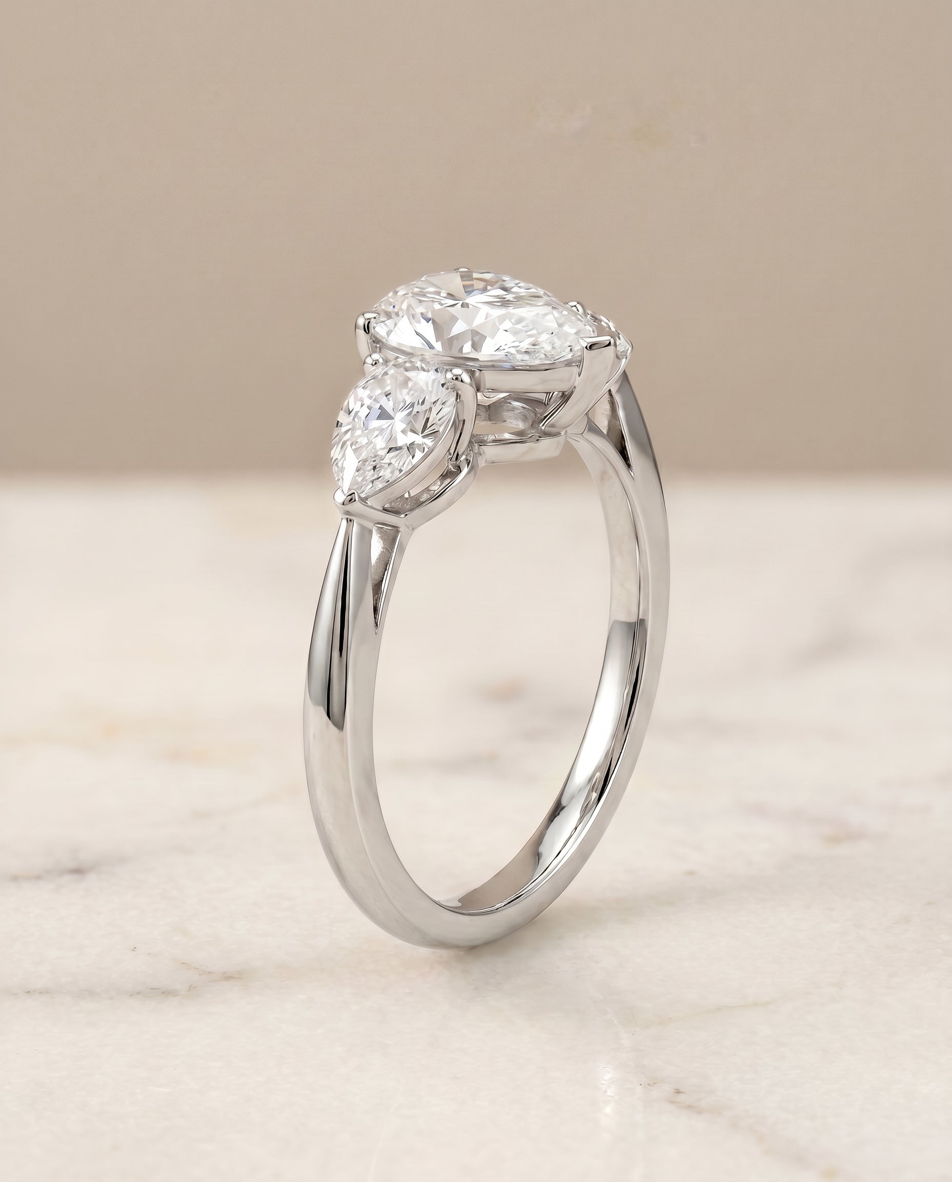 Three Stone Matched styling on The Angelica pear engagement ring setting | RockHer