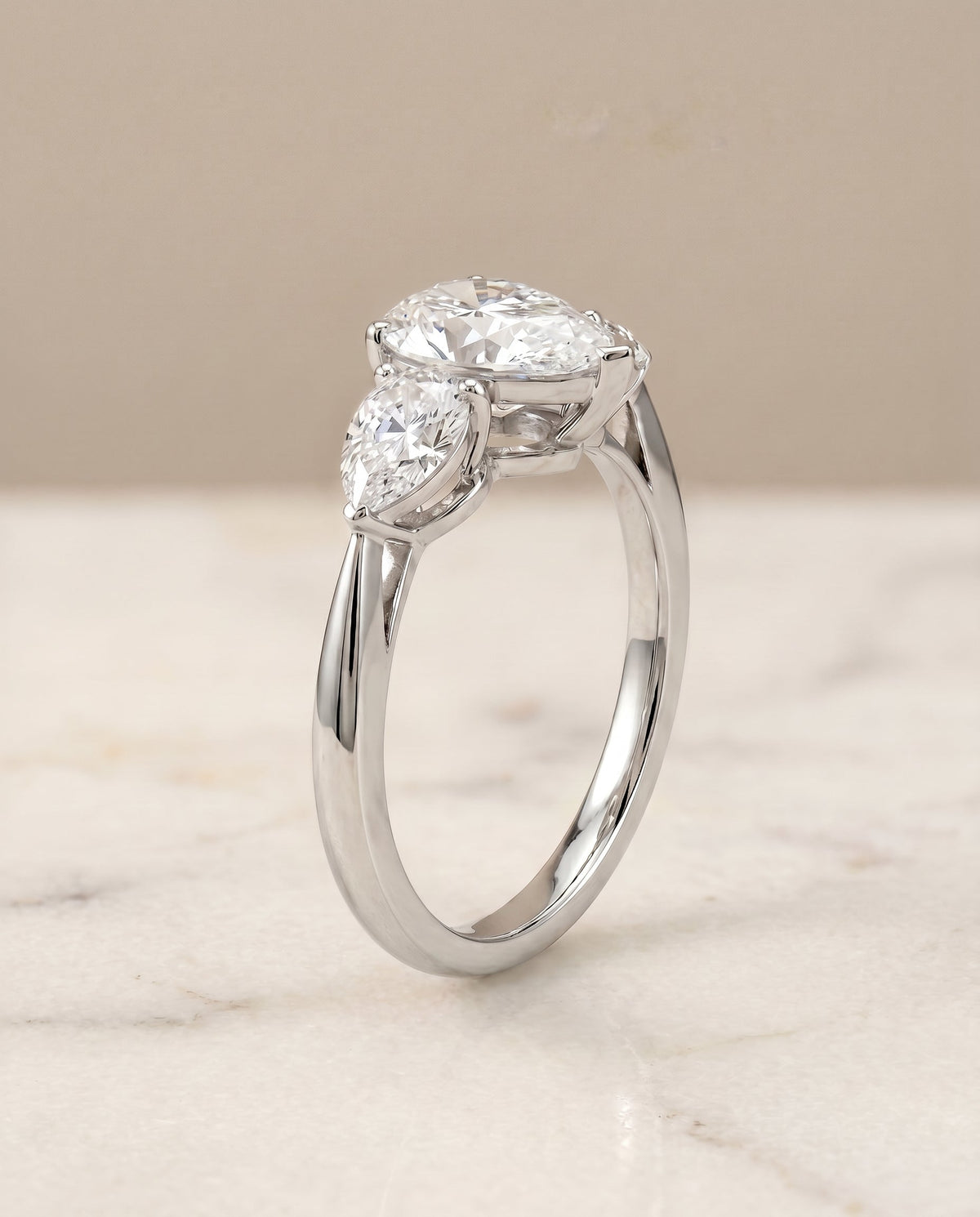 Angelica Select Three Stone Pear Lab Diamond Engagement Ring in Platinum, front view | RockHer