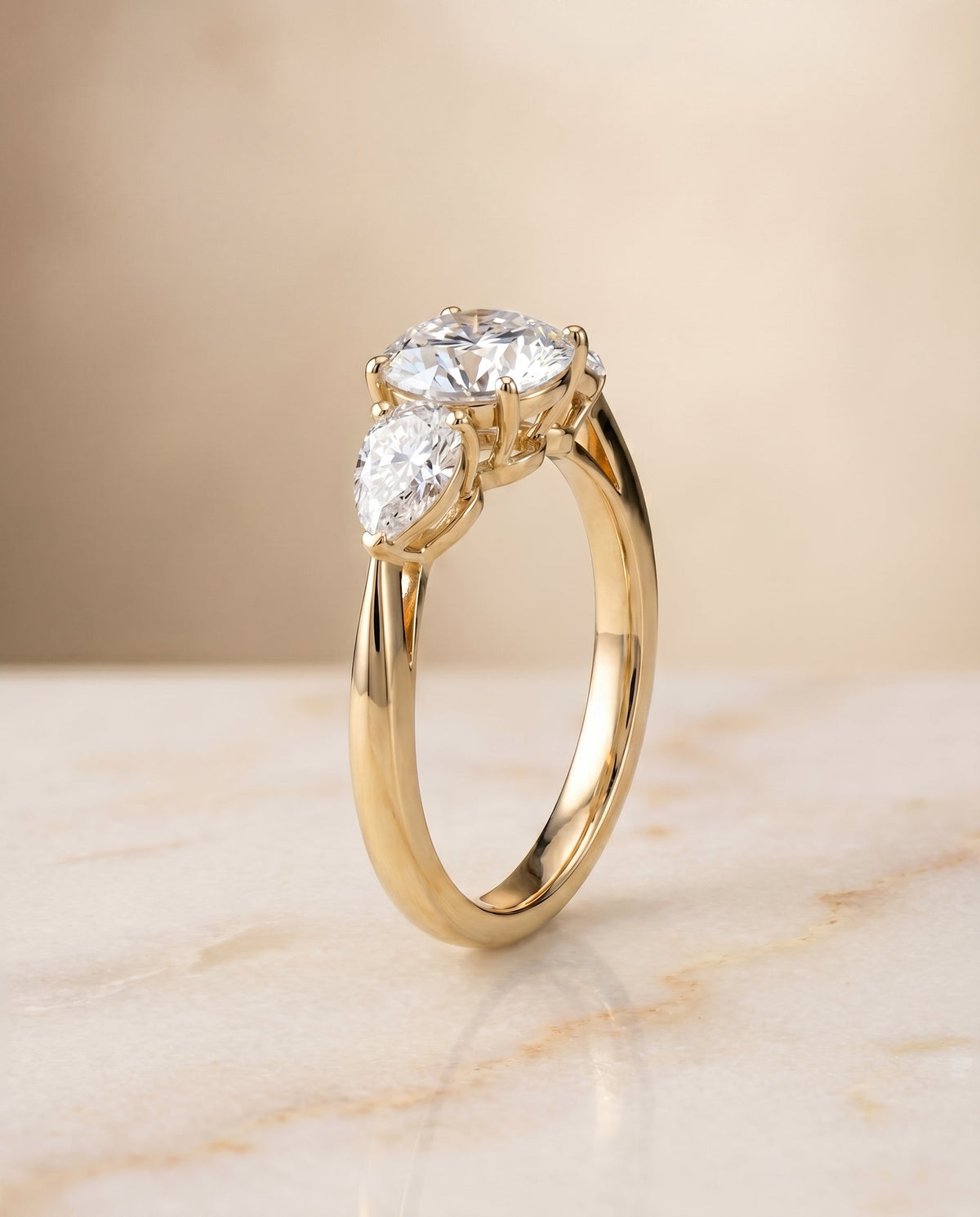 Angelica Select Three Stone Round Lab Diamond Engagement Ring in 18K Yellow Gold, front view | RockHer