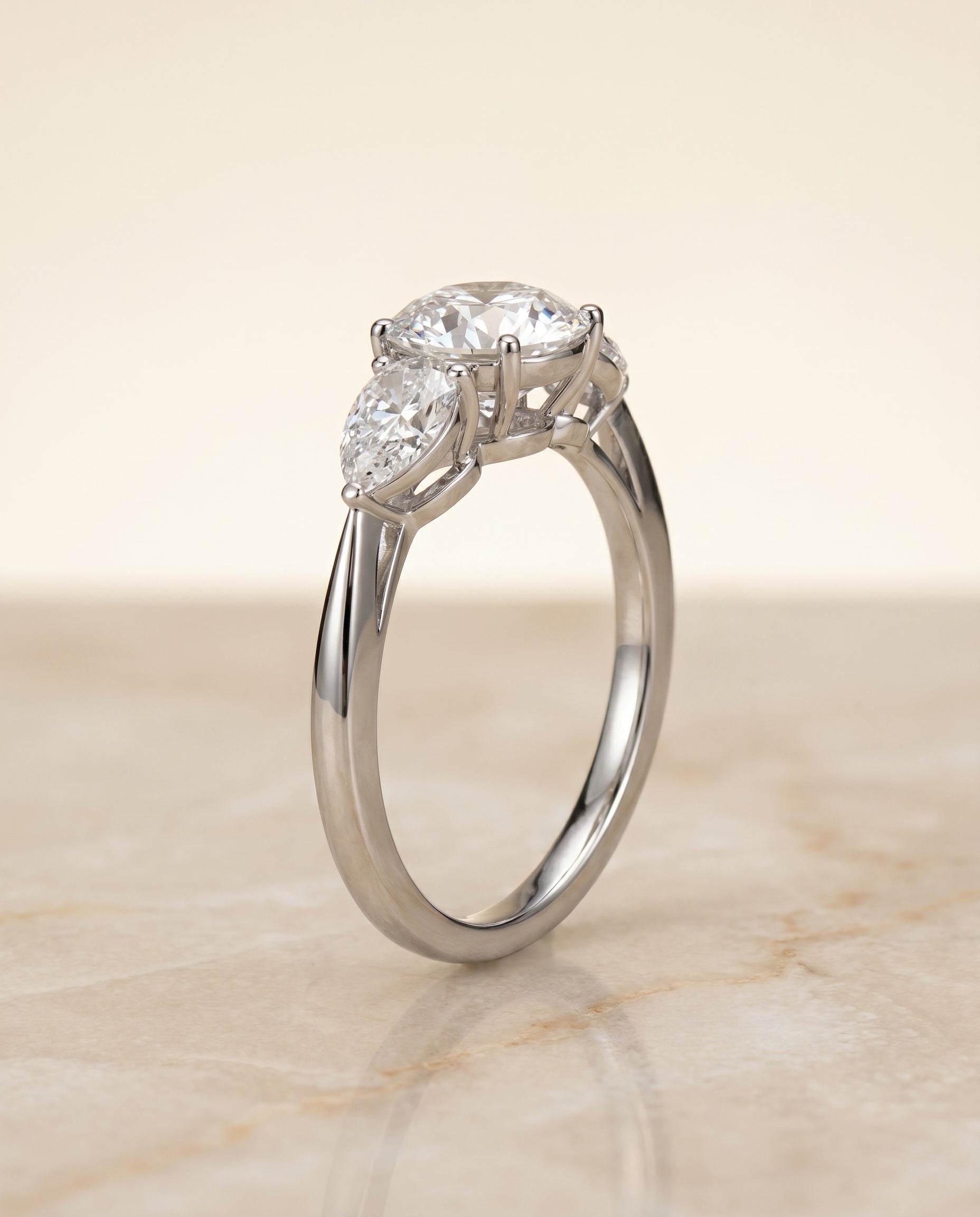 Three Stone Matched styling on The Angelica round engagement ring setting | RockHer