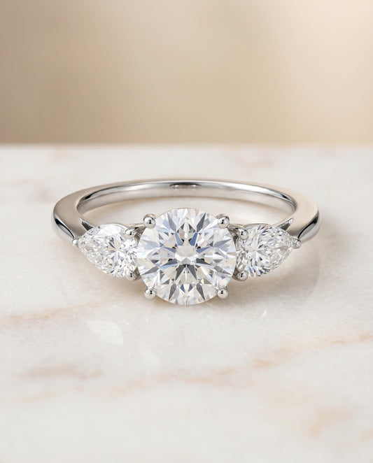 The Angelica Three Stone Engagement Ring Setting for Round Diamonds in Platinum