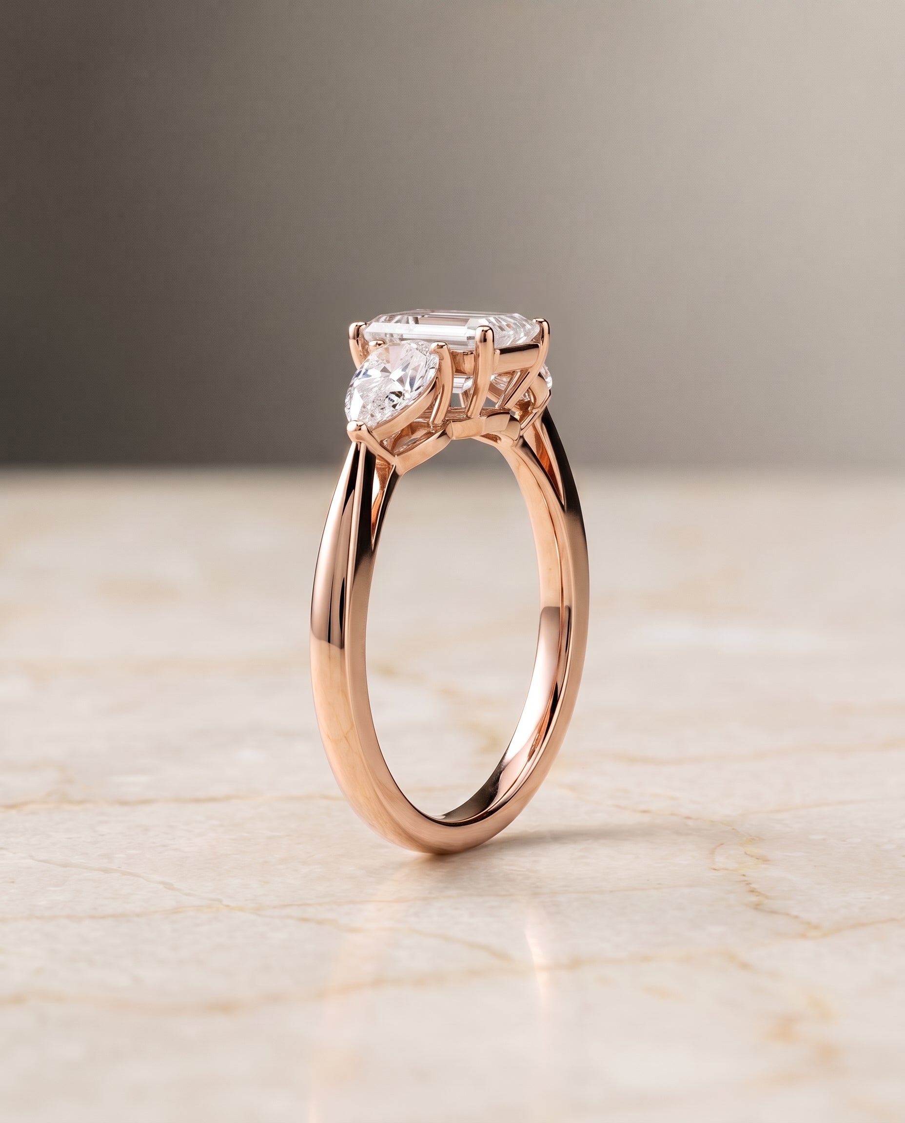 The Angelica Three Stone Matched Emerald Cut Engagement Ring Setting in 14K Rose Gold