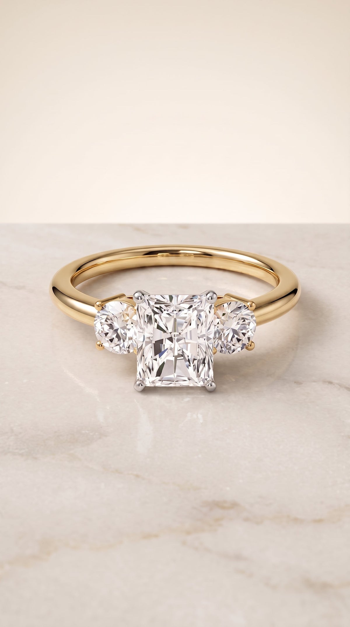 Anita Select Three Stone Radiant Cut Lab Diamond Engagement Ring in 18K Yellow Gold, shown on hand, angled | RockHer