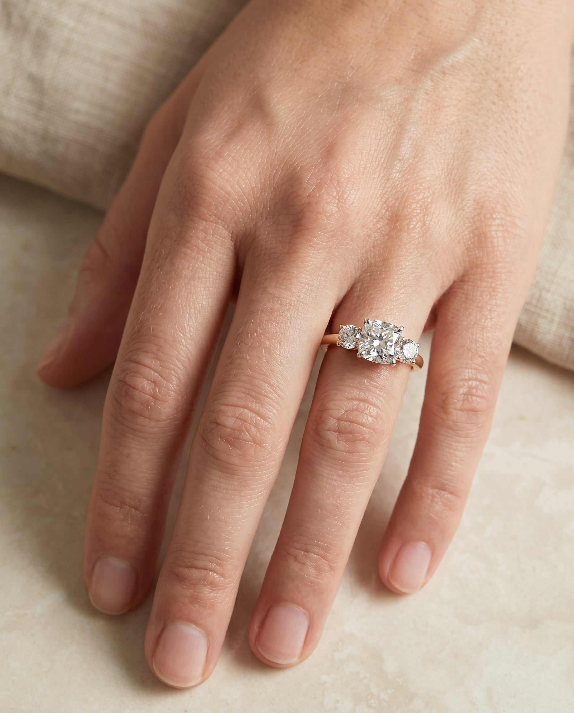 Anita Select Classic Three Stone Solitaire Round Lab Diamond Engagement Ring in 18K Yellow Gold, shown on hand | RockHer
