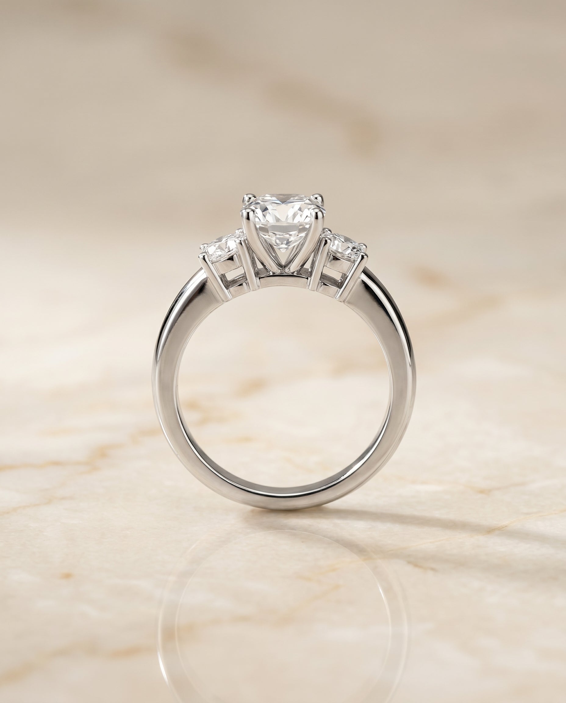 Anita Select Classic Three Stone Solitaire Round Lab Diamond Engagement Ring in Platinum, side view | RockHer