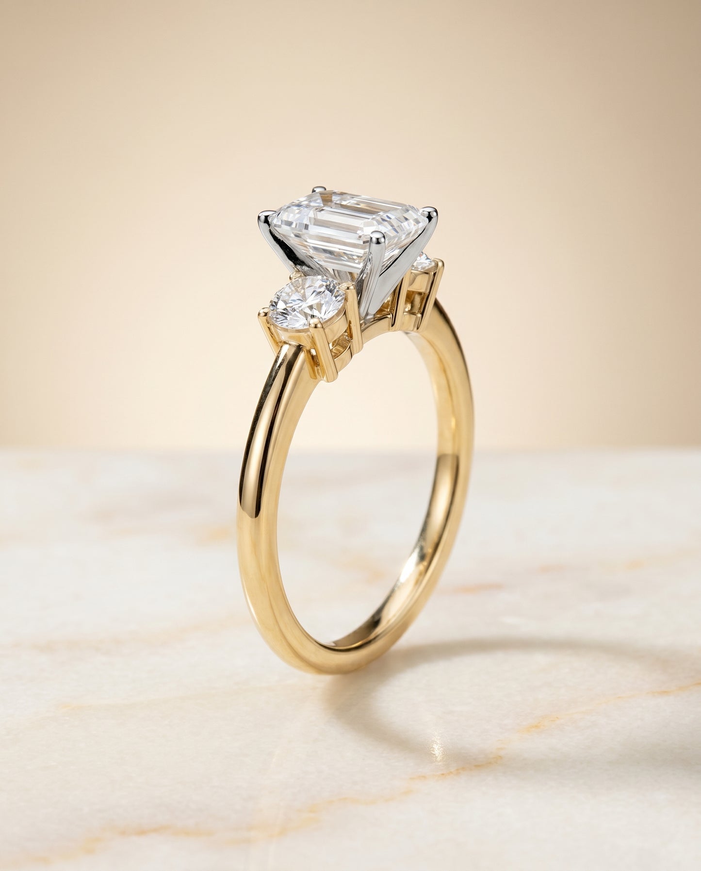 The Anita Three Stone Engagement Ring Setting for Emerald Cut Diamonds in 18K Yellow Gold